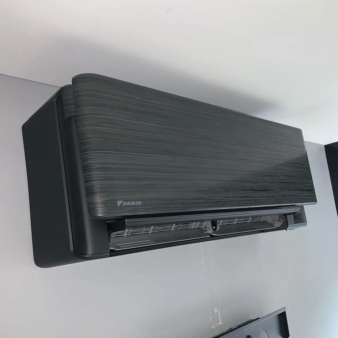 Daikin wall unit in a dark finish. A design-led unit chosen to suit the room.